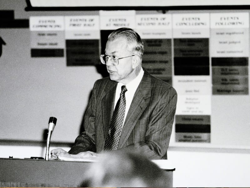 Dr. Zuck speaking while standing at a podium